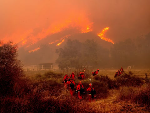 Inmate firefighters battle the Mountain Fire at Swanhill Farms in Moorpark, Calif., Nov. 7, 2024.