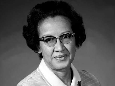 Katherine Johnson, seen here in 1971, performed crucial trajectory calculations for early NASA missions, overcoming racism and sexism.
