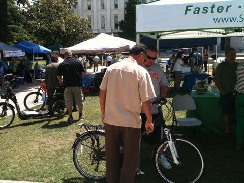 Traditional bicycles (in the foreground) and Lithium-powered scooters (in the background) were just some of the items to be reviewed at the Green Fair at the State Capitol. 