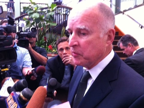 Gov. Jerry Brown speaks with reporters Wednesday afternoon after addressing the California State Association of Counties legislative conference at a Sacramento hotel.