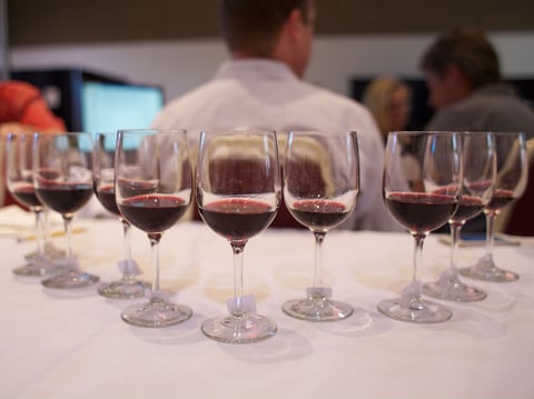 Tim Teichgraeber, Mari Wells Coyle, Bob Bath and Nick Goldschmidt debate the merits of the wines in the cabarnet blend class during the first session of judging at Cal Expo.