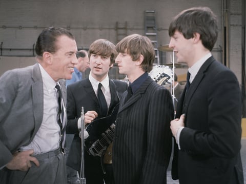 The Beatles chatting with Ed Sullivan.