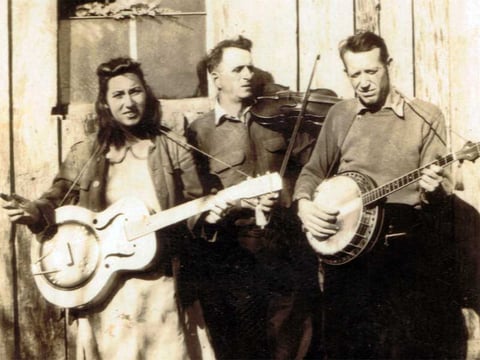 "Fiddlin' John" Sharp (center), seen here with daughter Evelyn and banjo player Red Morris, is among the many musicians whose stories and songs are documented in Bobby Fulcher's archive. 