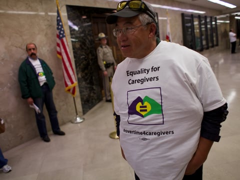 An IHSS supporter walks by Gov. Jerry Brown's office on Thursday Feb. 5,2015.