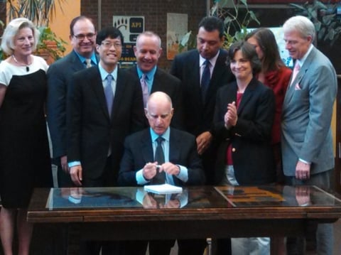 Gov. Jerry Brown signs his new school funding plan into law.