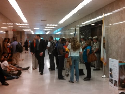 Activists hold a sit-in outside of California Gov. Jerry Brown's office in July 2013 in support of the TRUST Act.