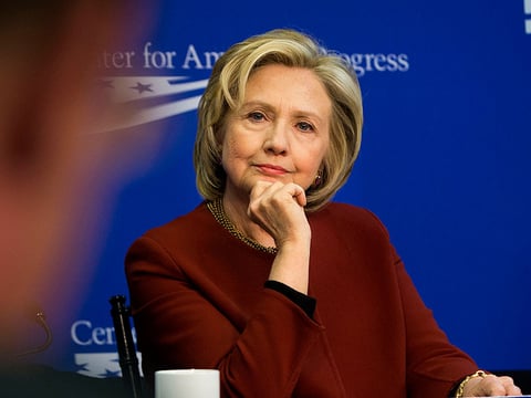 In this photo taken March 23, 2015, former Secretary of State Hillary Rodham Clinton listens during an event hosted by the Center for American Progress (CAP) and the America Federation of State, County and Municipal Employees (AFSCME), in Washington.