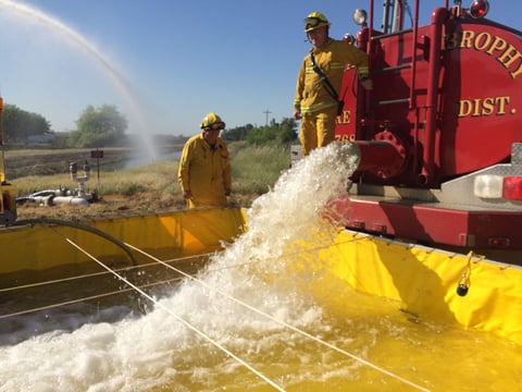 Cal Fire and local fire agencies practice delivering water in an event of a wildfire.