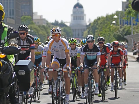 Riders race down Capital Mall during the first stage of the Amgen Tour of California cycling race in Sacramento, Calif., Sunday, May 10, 2015.