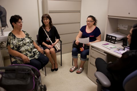Gloria R. Lopez, left, talks to Licensed Clinical Social Worker Uzma Nazir, far right, through Medical Interpreter Fabiola Cardenas, second from left.
