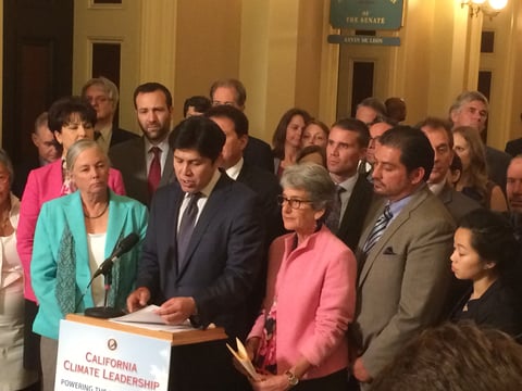 Senate President pro Tem Kevin de León (D-Los Angeles) celebrates his chamber's passage of legislation that would implement Gov. Jerry Brown's greenhouse gas reduction goals Wednesday at the state Capitol in Sacramento.
