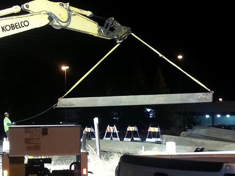 Crews preparing the sheets of metal that will be used to shore up the side of East Drain Canal while we make repairs to a broken transmission main.