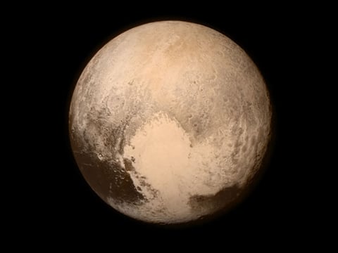 This July 13, 2015 image provided by NASA shows Pluto, seen from the New Horizons spacecraft. The United States is now the only nation to visit every single planet in the solar system.