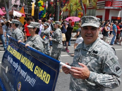 Chief Warrant Officer Mario Garcia, right, joins other members of the California National Guard during the L.A. Pride Parade on June 9, 2013. 