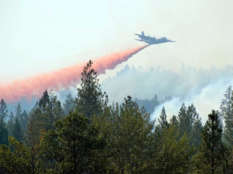 A C130 from the Colorado National Guard doing a retardant drop on the Peak Fire on Saturday, Aug. 15, 2015. 