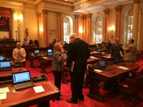 Senate Minority Leader Jean Fuller (R-Bakersfield) and Sen. Jim Beall (D-San Jose), who's authored highway funding legislation, talk on the Senate floor Friday.