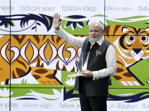 Prime Minister of India Narendra Modi waves to supporters during a visit to Google headquarters Sunday, Sept. 27, 2015, in Mountain View , Calif. 

