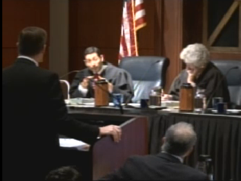 Plaintiffs' attorny Thomas Hiltachk (L) gives his oral argument to the California Supreme Court Tuesday as Justices Mariano-Florentino Cuéllar and Carol Corrigan listen.