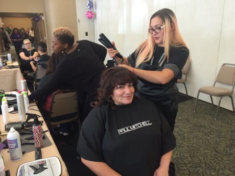Terrie Barraza gets her hair styled at a conference put on by the Sacramento County Probation Department.