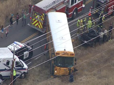 The California Highway Patrol investigates a fatal crash between a school bus and a vehicle on Thursday, Oct. 22, 2015.