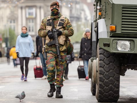 A Belgian Army soldier patrols on a main boulevard in Brussels on Sunday.
