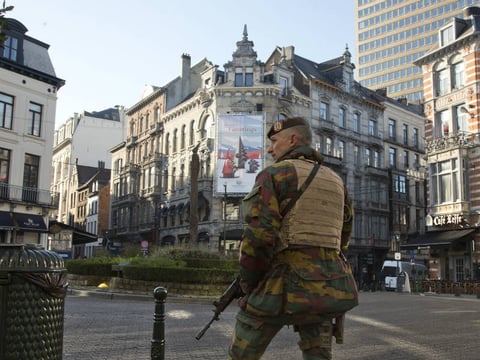 A Belgian Army soldier patrols in the Sablon District of Brussels on Monday, Nov. 23, 2015.