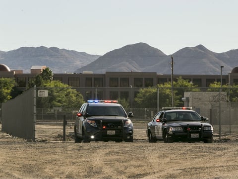 Authorities are stationed near the Inland Regional Center, Wednesday, Dec. 2, 2015, in San Bernardino, Calif. 