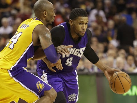 Los Angeles Lakers guard Kobe Bryant, left, guards Sacramento Kings forward, Rudy Gay, during the second half of an NBA basketball game in Sacramento, Calif., Thursday, Jan. 7, 2016. The Kings won 118-115.