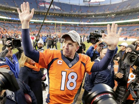 Denver Broncos quarterback Peyton Manning waves to spectators following the NFL football AFC Championship game between the Denver Broncos and the New England Patriots, Sunday, Jan. 24, 2016, in Denver. 