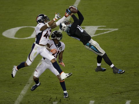 Carolina Panthers’ Corey Brown (10) catches a pass in front of Denver Broncos’ T.J. Ward (43) and Aqib Talib (21) during the second half of the NFL Super Bowl 50 football game Sunday, Feb. 7, 2016, in Santa Clara, Calif.