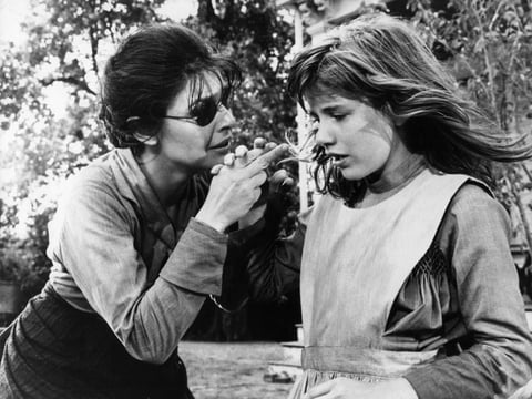 Anne Bancroft holds Patty Duke's hand to teach her a new word in a scene from the film The Miracle Worker, in 1962.
