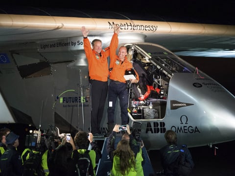 Solar Impulse 2 pilots Bertrand Piccard (right) and Andre Borschberg celebrate after Piccard landed their solar-powered plane at Moffett Field in Mountain View, Calif., on Saturday.

