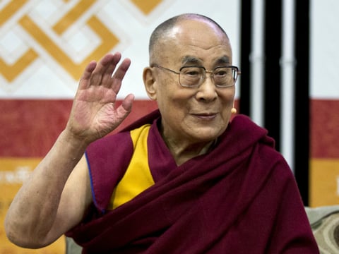 FILE - In this June 13, 2016 file photo, the Dalai Lama waves during an event at American University in Washington. 