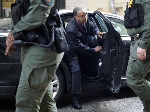 Officer Caesar Goodson, one of six Baltimore city police officers charged in connection with the death of Freddie Gray, arrives at the courthouse in Baltimore ahead of Thursday's verdict.