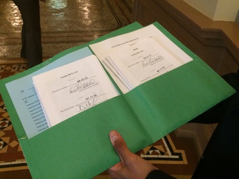 Members of the Assembly Clerk's Office deliver some of the bills lawmakers passed to Gov. Jerry Brown's office on Thursday, June 30th, 2016.