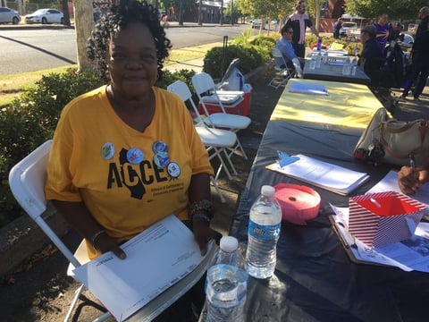 Denise Davis, vice president of Alliance of Californians for Community Empowerment, tabling at Oak Park's "Night Out" alternative event.