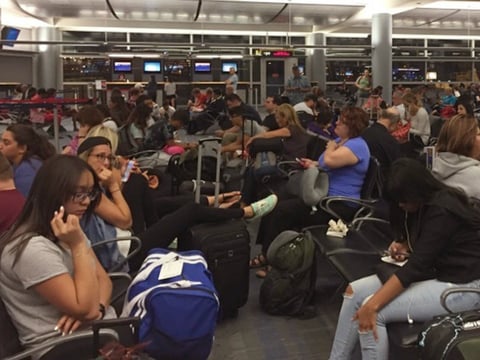 Passengers packed the boarding area at McCarran International Airport in Las Vegas following Monday's Delta outage.