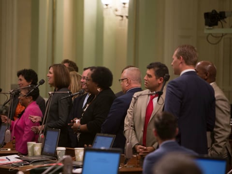 Assembly Speaker Emeritus Toni Atkins (D-San Diego) receives a gospel sendoff from the California state Assembly sung by fellow assembly members at the end of session, early Thursday morning, Sept. 1, 2016. 