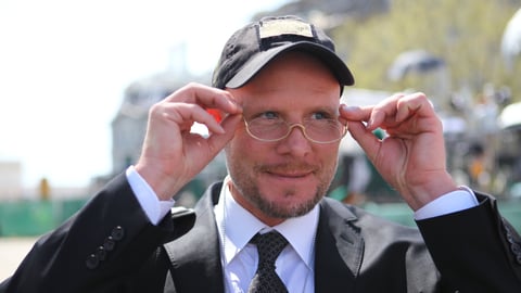 NPR photographer David Gilkey adjusts his glasses on the White House lawn before going to meet President Obama in 2011. Gilkey won the White House News Photographers Association's award for "Best Photographer of the Year, 2010."
