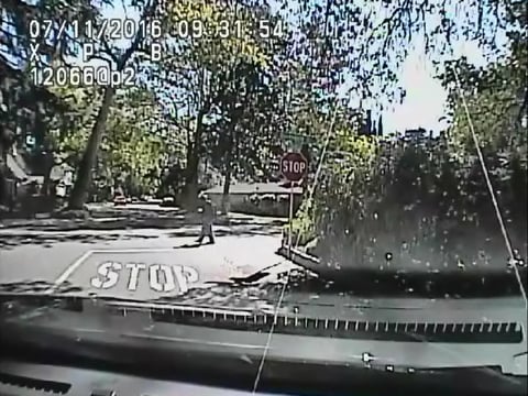 This still frame from Sacramento Police car camera video shows Joseph Mann acting erratically as an officer yells at him through a bull horn to comply with officers' instructions.