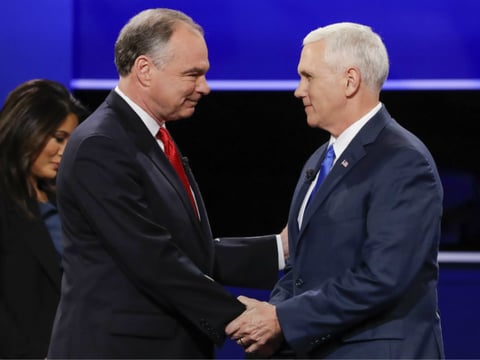 Republican vice-presidential nominee Gov. Mike Pence, right, and Democratic vice-presidential nominee Sen. Tim Kaine shake hands during the vice-presidential debate at Longwood University in Farmville, Va., Tuesday, Oct. 4, 2016. 