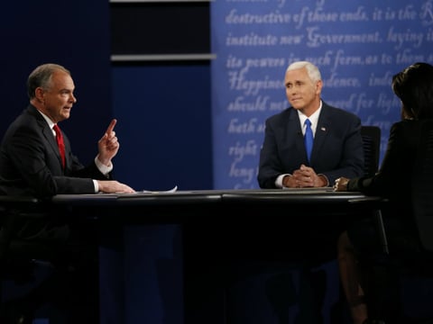 Republican vice-presidential nominee Gov. Mike Pence, right, and Democratic vice-presidential nominee Sen. Tim Kaine speak as Moderator Elaine Quijano of CBS News, right, listens during the vice-presidential debate at Longwood University.