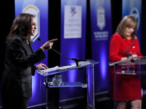 California U.S. Senate Democratic candidate California Attorney General Kamala Harris, left, speaks as Congresswoman Loretta Sanchez, center, listens during a debate, Wednesday, Oct. 5, 2016, in Los Angeles.