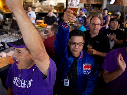 Kings fans gather and celebrate at a Midtown bar after learning their team would stay in Sacramento.