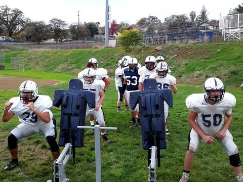 Alic Castillo and Tristan Krisman finish a blocking sled drill during an Amador Buffaloes practice.