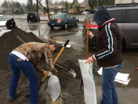 Owen Fountain and his mother, Jennifer Duran, fill sand bags in Yuba City on Jan. 7, 2017. They worry their rental property in Marysville may suffer flood damage if the area receives more rain.