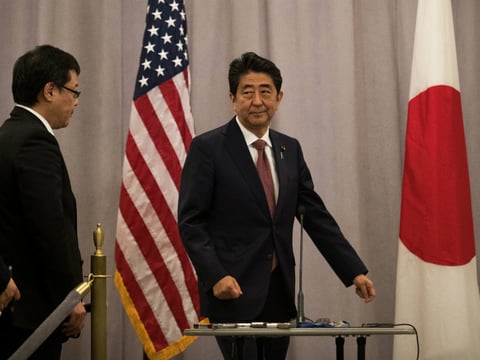 Prime Minister of Japan Shinzo Abe arrives to speak to reporters following a meeting with Donald Trump in November.