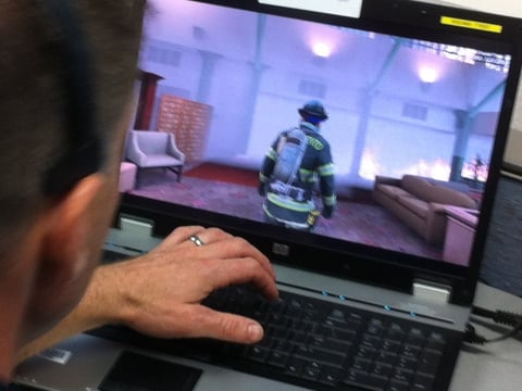 A member of the Sacramento Fire Department maneuvers his avatar during training on the Enhanced Dynamic Geo-Social Environment or EDGE program.  The training took place at the police department station on Richards Boulevard.