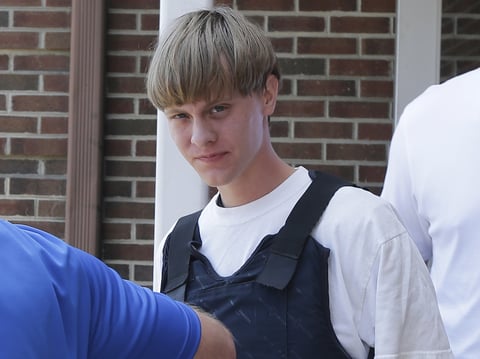 Dylann Roof is escorted from the Shelby Police Department in Shelby, N.C., on June 18, 2015.