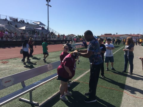 The VIP Games invited media members to help present medals to the winners of the events. The staff are volunteers.